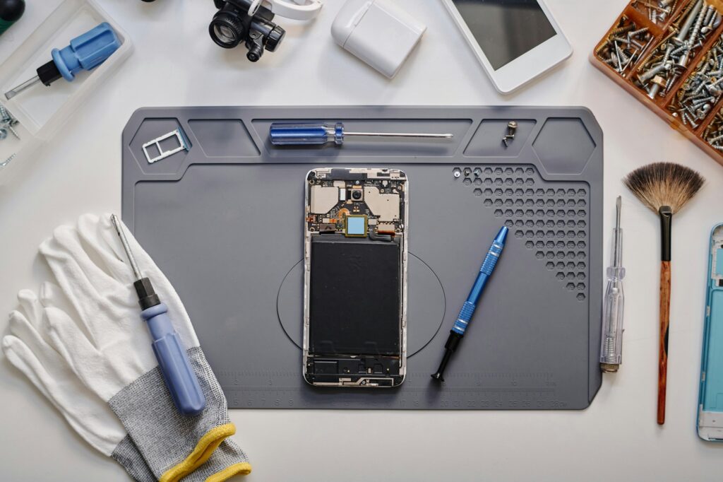 Elements of Faulty Mobile Phone Before Repairing in Workshop